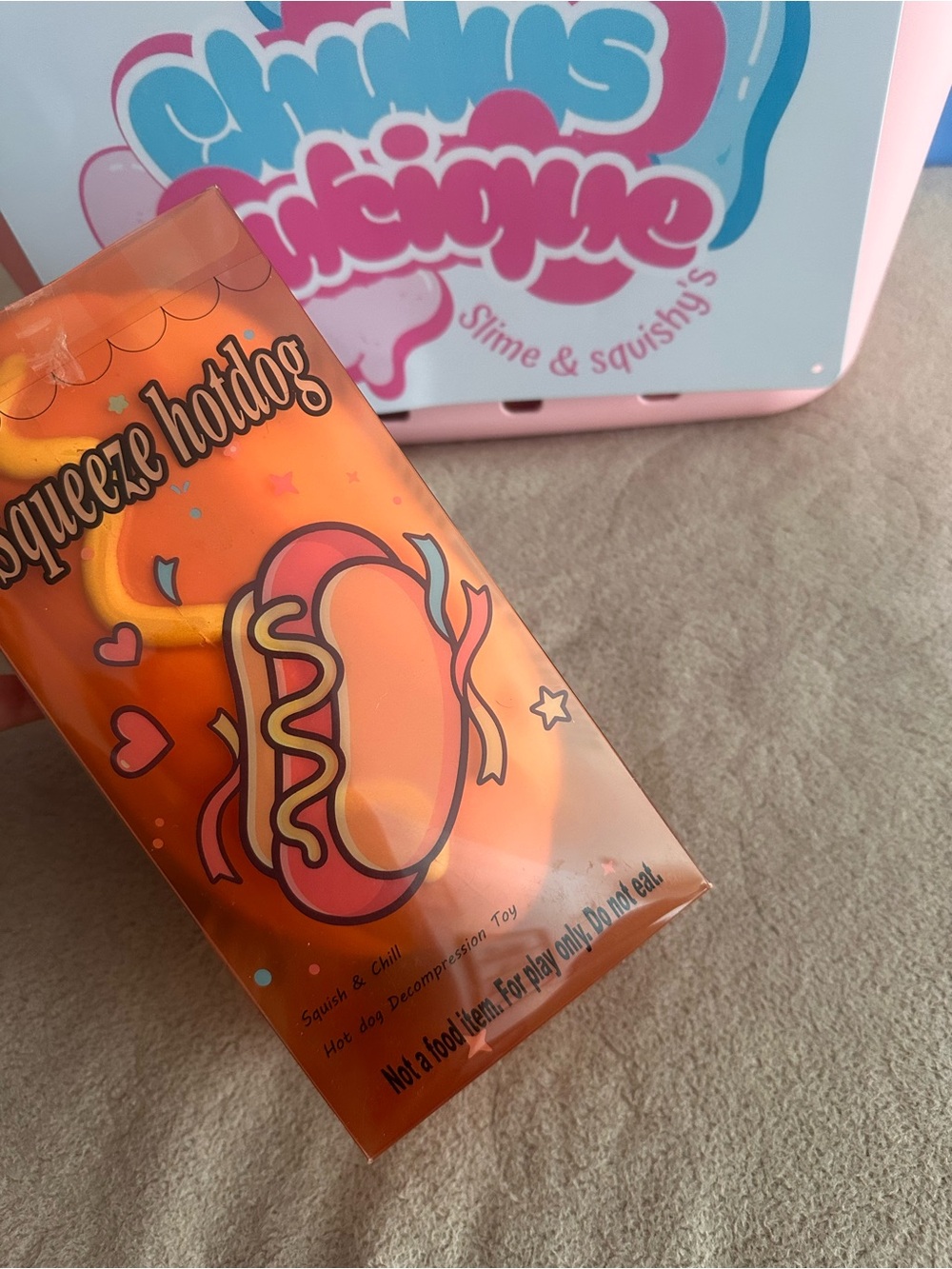 Squeeze Hotdog Orange Squishy Toy by Chunky’s Machine